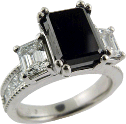 Two Emerald Cut Diamonds And A Black Diamond Ring