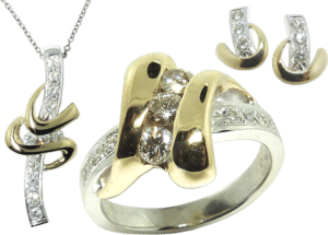 Old fashioned men's ring converted into a diamond ring, pendant, and matching earrings set