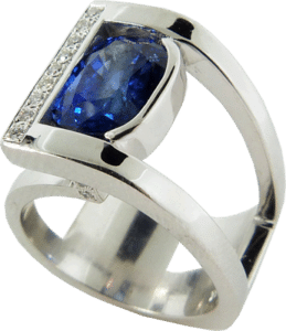 Blue four carat Sapphire ring with accent diamonds