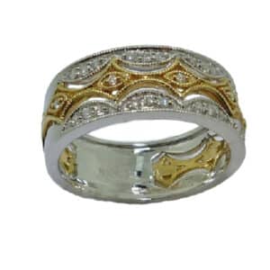 14 karat white and yellow gold vintage diamond ring, set with 29 round brilliant cut diamonds totaling 0.21 carats.