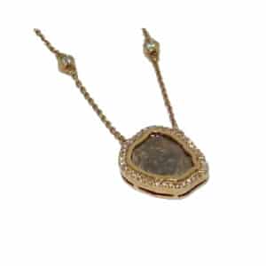 Rose gold pendant set with a diamond slab