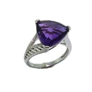 14K white gold ring with a claw set 5.87ct triangular shape fancy cut amethyst and 12 pave set diamonds, 0.045cttw.