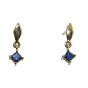 14 karat yellow gold drop earrings set with two sapphires with a total weight of 0.69 total carat weight.