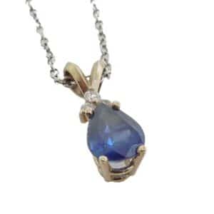 This gorgeous 14 karat pendant features a 1.42 carat pear-shaped sapphire. The sapphire is accented by 3 round brilliant cut diamonds.