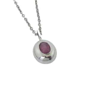 14k white gold pendant with a polished finish and an oval raspberry sapphire, 1.08 carat.