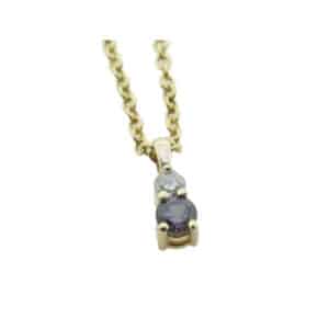 14k yellow gold pendant set with a round brilliant cut diamond and a colour change garnet