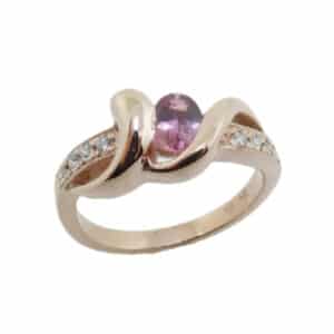 14 karat rose gold open design ring featuring an oval 0.46ct Padparadscha sapphire and accented with 0.112ctw of round brilliant cut diamonds.