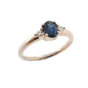 14 karat rose gold ring featuring a 0.543ct oval sapphire and 2 = 0.07ct, excellent cut, F/G, SI, round brilliant cut diamonds.