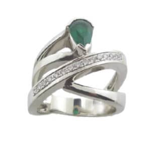 14 karat white gold ring set with a 0.60ct pear shaped emerald and accented by 15 = 0.082ctw, G/H, SI, round brilliant cut diamonds. This stunning ring is a custom design by David. Emerald is the birthstone for May.