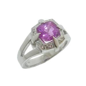 14K white gold custom lady's split shank halo ring by Studio Tzela set with a 1.83ct cushion cut pink-purple sapphire and 16 diamonds pave set in the halo, 0.112cttw.