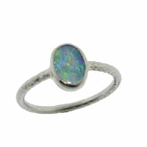 14 karat white gold ring featuring an opal doublet. Opal is the birthstone for November. This ring is a custom design by David.