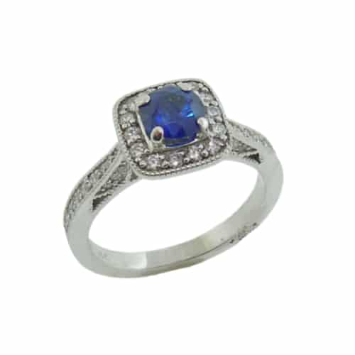 18 karat white gold ring set with a 0.726 carat sapphire and 0.39 total carat weight, excellent cut, F/G, SI1, round brilliant cut diamonds. The vintage cushion halo design also features milgrain details.