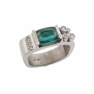 A fun fashion ring in 14 karat white gold. Showcasing a 2.41 carat fancy cut Green Tourmaline. Accented with diamonds totaling 0.12 carats. Created by our jeweler and owner, David Blitt as part of our Studio Tzela line. The perfect gift for 8th anniversaries.