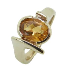 14 karat yellow gold ring semi bezel set with a 1.16ct oval citrine. This stunning gemstone is the birthstone for November.