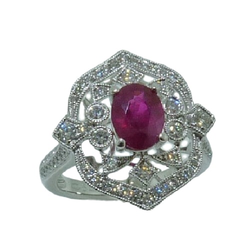 This art deco inspired 14 karat white gold fashion ring showcases an oval shaped 1.23 carat Ruby. Accented with diamonds totaling 0.58 carats. This piece is a perfect gift to represent July birthdays and 40th anniversaries.