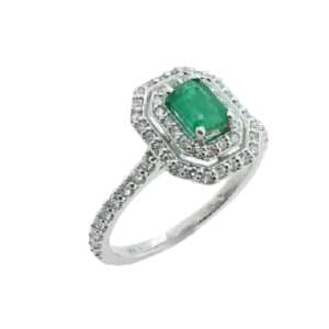 14 karat white gold double halo ring set with a 0.442ct Emerald accented by 62 = 0.37ctw round brilliant cut diamonds. Emerald is the birthstone for May.