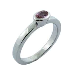 14 karat white gold ring with a bezel set 0.34ct Padparadscha sapphire.