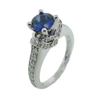 14 karat featuring a stunning 1 carat sapphire and is accented by 0.75 carats total weight of diamonds.
