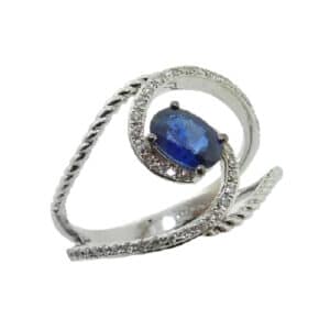14 karat ring featuring an oval sapphire accented with diamonds in a modern, open twist design.