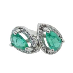 14 karat white gold stud earrings set with 2 = 0.324ctw pear shaped emeralds and accented by 0.06ctw, H, SI2-I1, round brilliant cut diamonds. Emeralds are the birthstone for May.