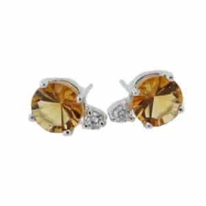 14 karat white gold stud earrings set with 2 = 2.31ct laser cut citrines and accented with 2 = 0.125ctw round brilliant cut diamonds.