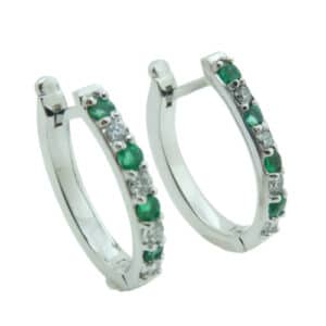 14 karat white gold hoop earrings set with 8 = 0.33ctw emeralds and 0.253ctw, H/I, SI1-2, round brilliant cut diamonds. Emerald is the birthstone for May.