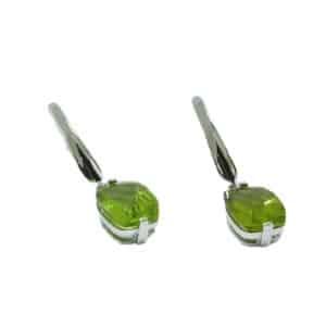 A pair of 14 karat white gold dangle drop earrings, showcasing fancy cut Peridots totaling 4.40 carats. A perfect gift to represent August birthdays and 20th anniversaries.