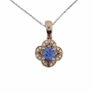 This 0.72 carat round tanzanite has a vintage style diamond halo, set in rose gold for a beautiful colour combination, it's the perfect addition to any jewelry collection... or neckline!