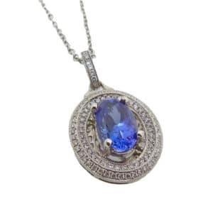 With a deep purple/blue hue, this stunning 2.52 carat oval tanzanite sits in a double halo of diamonds. With 89 diamonds totaling 0.32 carats, this pendant packs both sparkle and colour!