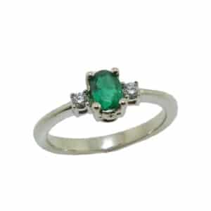 14 karat white gold ring set with a 0.44ct emerald and 2 = 0.06ctw round brilliant cut diamonds. Emerald is the birthstone for May.
