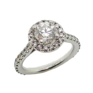 Platinum halo engagement ring featuring a 0.786ct, F, SI1 round brilliant cut diamond by Hearts on Fire accented by 38 = 0.45ctw round brilliant cut diamonds.