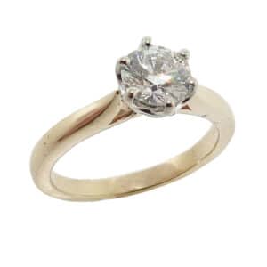 14 karat yellow and white 6 prong solitaire engagement ring featuring a 0.772ct Ideal cut, I, VS2 round brilliant cut diamond by Hearts on Fire.