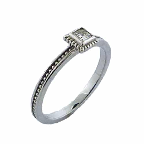 14K white gold bezel set stackable ring with milgrain detail. Set with one 0.162 carat Dream cut Hearts On Fire diamond