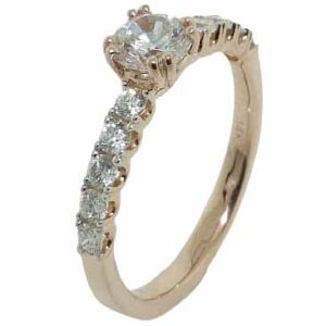 14 karat rose vintage design solitaire engagement ring featuring 10 = 0.35ctw round brilliant cut diamonds. This unique design is a great alternative to a traditional solitaire ring. Priced without a center gemstone. Let us find you the perfect center that fits your tastes and budget!