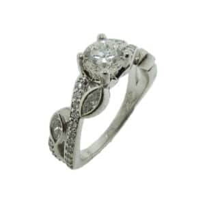 14K White gold engagement ring with leaf inspired details. Claw set into the centre is one 0.706ct, G/H, SI2, good to v.good cut, Canadian diamond with inscription CD-17800, no Canadian cert. and set along the band are 4 bezel set marquise diamond and round brilliant cut diamonds totaling 0.46cttw, SI/VS.