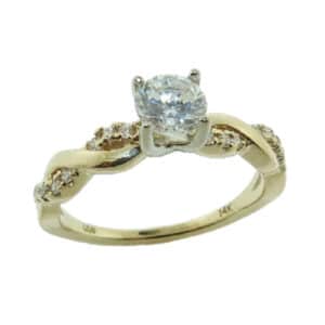 14 karat yellow and white gold twist solitaire design engagement ring accented by 0.11ctw G/H, VS-SI round brilliant cut diamonds. This unique design is a great alternative to a traditional solitaire ring. Priced without a center gemstone. Let us find you the perfect center that fits your tastes and budget!