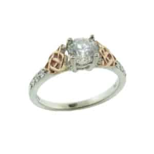 14 karat white and rose celtic design engagement ring accented by 6 = 0.13ctw G/H, SI1 round brilliant cut diamonds. Priced without a center gemstone. Let us find you the perfect center that fits your tastes and budget!