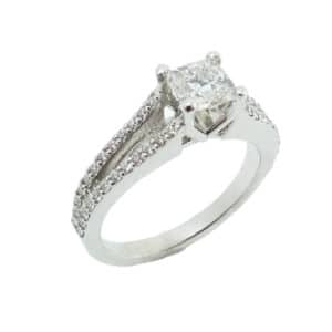 14K White gold split shank engagement ring set with a 0.64ct radiant cut, SI1, G very good cut Canadian diamond accented on the bands with 48 claw set round brilliant cut diamonds, 0.40cttw, VS-SI, F/G.