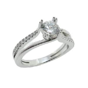 14K White gold split shank engagement ring by Frederic Sage featuring split prongs on the centre 0.75ct CZ. The split shank band has 20 mircoset diamonds totaling 0.13 carats graduating in size towards the centre and an opposite polished shank. Available in 14K gold, 18K gold, or platinum. This ring can be made in any combination of white, pink or yellow gold and can be customized to accommodate different size and shape diamonds, by special order.