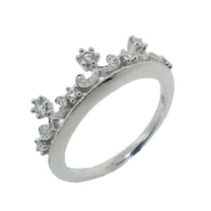 A beautiful band from the “Lumiere Bridal” collection. Inspired by royalty, this tiara crown band is fit for princesses and queens alike. Match next to an engagement ring for ever after, crown your stack or wear on it's own as a fun fashion piece. 18 karat white gold, set with diamonds totaling 0.20 carats.