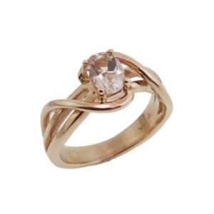 14 karat rose gold ring, showcasing a 0.72 carat oval shaped Morganite. Created by our jeweler and owner, David Blitt as part of our Studio Tzela line. A unique piece that can be used as an engagement ring or a fashion ring.
