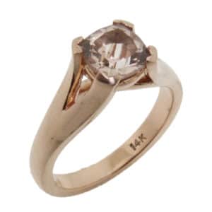 A 14 karat rose gold ring, Showcasing a 0.96 carat cushion cut Morganite. A beautifully simple piece that can be used for an engagement ring or a fashion ring.
