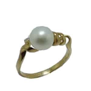 14 karat yellow gold modern design ring featuring a pearl and accented with a diamond. Pearl is the birtstone for June.