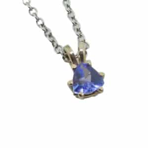 In 14K white gold with a deep purple/blue hue, this trillion cut tanzanite pendant is something unique!