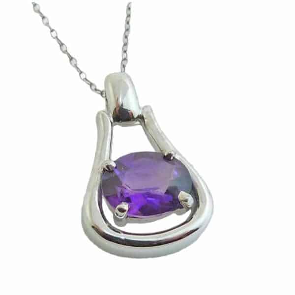 14K White gold pendant showcasing a 2.04 carat oval shaped amethyst. The perfect gift for February birthday and 8th anniversaries.