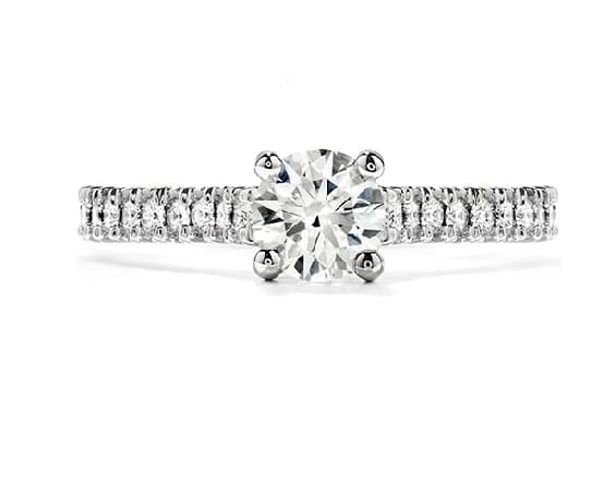 Platinum Enticement solitaire engagement ring featuring a 0.50ct CZ. This stunning ring has 0.30ctw G/H, VS/SI round brilliant cut Hearts On Fire diamonds on the band. A matching wedding band is available. This style is now discontinued.