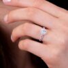 Destiny Lace Diamond Intensive Halo Engagement Ring by Hearts on Fire white gold on a model's hand