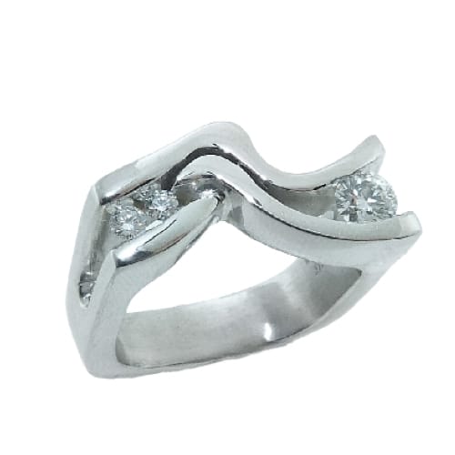 14K White gold lady's right hand ring by Studio Tzela channel set with one 0.263 carat, H, SI1, ideal cut, round brilliant cut non-serialized diamond by Hearts On Fire. Accented with two G/H, SI, ideal cut, round brilliant cut diamond by Hearts On Fire, totaling 0.081 carat.