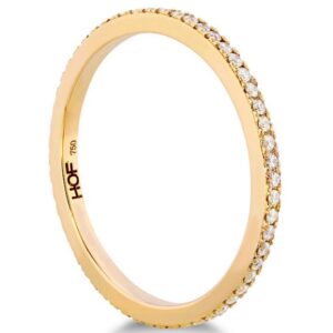 18 Karat yellow gold Hearts On Fire eternity band totaling 0.19 carats of diamonds I/J, SI. Also available in white and rose gold.