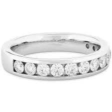 Platinum wedding band channel set with ideal cut, round brilliant cut diamonds by Hearts On Fire, 0.40 carat total weight I/J, VS-SI.